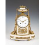 A 19th century French Neoclassical style gilt metal and white marble mantle clock, the convex enamel