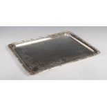 A George V silver tray, London, 1926, makers mark of RS, with reeded and foliate chased border,