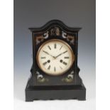 A 19th century Continental ebonised and brass inlaid cuckoo mantle clock, the enamelled dial with