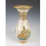 A Japanese Satsuma pottery vase, Meiji Period, decorated with lohan figures, within richly gilded