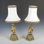 A pair of late 19th/ early 20th century gilt metal figures of Cavalier's later mounted as table