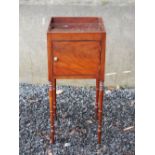 A 19th century mahogany and ebony lined bedside locker, the square top with raised gallery and two