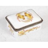 A late 19th/ early 20th century white metal mounted rectangular porcelain box and cover, decorated