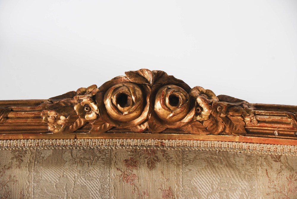 A late 19th century gilt wood sofa, the reeded top rail centred with flower and foliate carved - Image 4 of 17