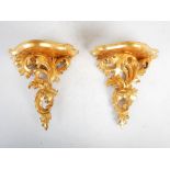 A pair of Florentine carved giltwood wall brackets, 20.5cm wide x 21.5cm high.