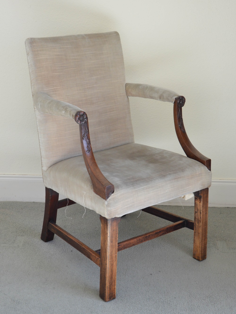 A 19th century mahogany Gainsborough armchair, the velvet upholstered back, arms and seat raised