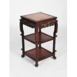 A Chinese dark wood jardiniere stand, late Qing Dynasty, the square top with a mottled red marble