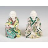 Two Chinese porcelain scholars, late 19th/ early 20th century, one modelled kneeling wearing a