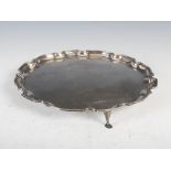 A 20th century silver salver, Sheffield, 1978, makers mark of FH, with scalloped edge, raised on