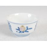 A small Chinese porcelain blue and white bowl, decorated with finger citrus, peach and pomegranate