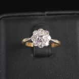 A 20th century diamond cluster ring by Harold Gillow & Son, centred with a round brilliant cut