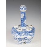 A Chinese porcelain blue and white tulip vase, Qing Dynasty, decorated with two panels of dancing