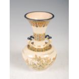 A Japanese Satsuma pottery twin handled bottle vase, Meiji Period, decorated with richly gilded