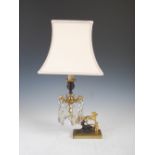 A 19th century gilt metal and bronze mounted candlestick later mounted as a table lamp, the