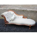 A 19th century rosewood chaise lounge, with velvet upholstered button down back and serpentine seat,