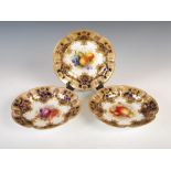 A set of three Royal Worcester fruit dishes decorated by H. Martin, A. Shuck and F. Phillips,