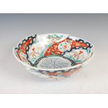 A Japanese Imari bowl, late 19th/ early 20th century, decorated with a central hexagonal shaped