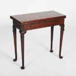 A George III mahogany tea table, the hinged rectangular top above a plain frieze with single drawer,