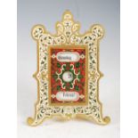 A late 19th century German gilt metal and champleve enamel desk calendar, with adjustable day,