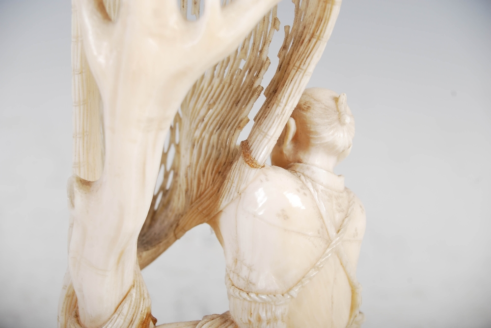 A Japanese ivory okimono of a fisherman tending net, Meiji Period, on carved wood stand, overall - Image 8 of 9