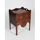 A George III mahogany tray top commode, the rectangular top with raised gallery and kidney shaped