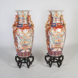 A large pair of modern Chinese porcelain Imari floor vases on stands, 20th century, decorated with