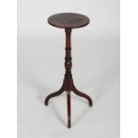 A 19th century George III style mahogany occasional table, the circular top with reeded edge, raised