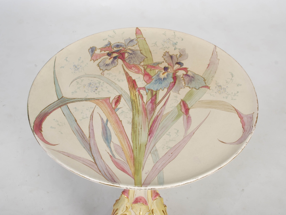 A late 19th century pottery occasional table, the circular top decorated with iris, raised on a - Image 2 of 9