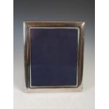 A modern silver photograph frame, Sheffield, 2003, makers mark of RC, 31cm x 26cm.