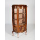 A late 19th/early 20th century French Louis XV style mahogany and gilt metal mounted vitrine of