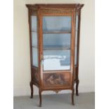 A late 19th century Louis XV style mahogany and gilt metal mounted vitrine, the mottled red and