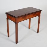 A George III style mahogany tea table, the hinged rectangular top with flower carved edge above a