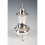 A George V silver sugar caster, Sheffield, 1930, makers mark of HA, raised on three shaped feet, 9.9