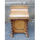 A Victorian burr walnut Davenport, the rectangular pop up top with pierced brass gallery, hinged and