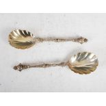 A pair of Victorian silver berry spoons, London, 1890, makers mark of C.E, with orb shaped