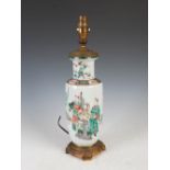 A Chinese porcelain famille verte rouleau vase mounted as a table lamp, Qing Dynasty, decorated with