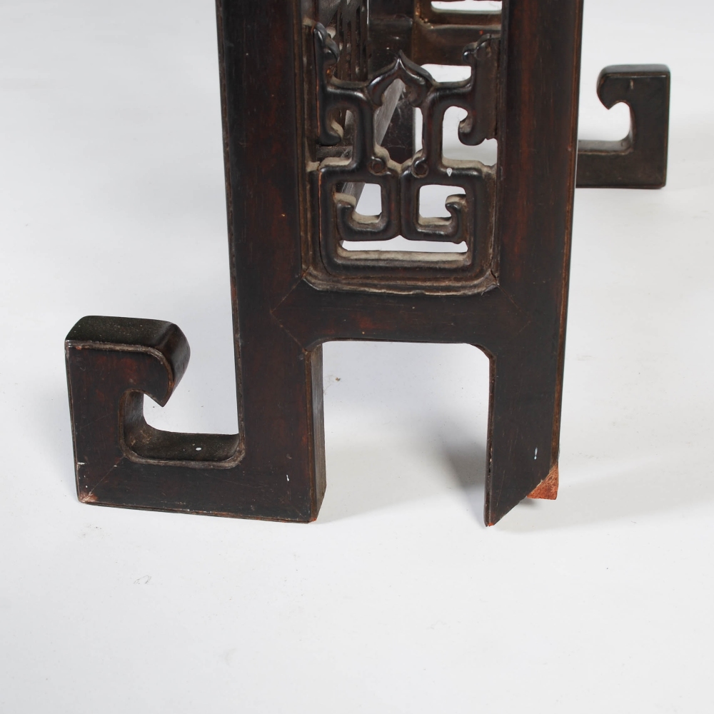 A Chinese dark wood table, late 19th/early 20th century, the rectangular panelled top above a - Image 5 of 10