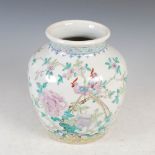 A Chinese porcelain famille rose vase, Qing Dynasty, decorated with peony and pair of long tailed