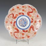 A Japanese Imari porcelain dish, late 19th/early 20th century, of shaped circular form centred