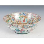 A Chinese porcelain famille rose Canton punch bowl, Qing Dynasty, the interior decorated with a