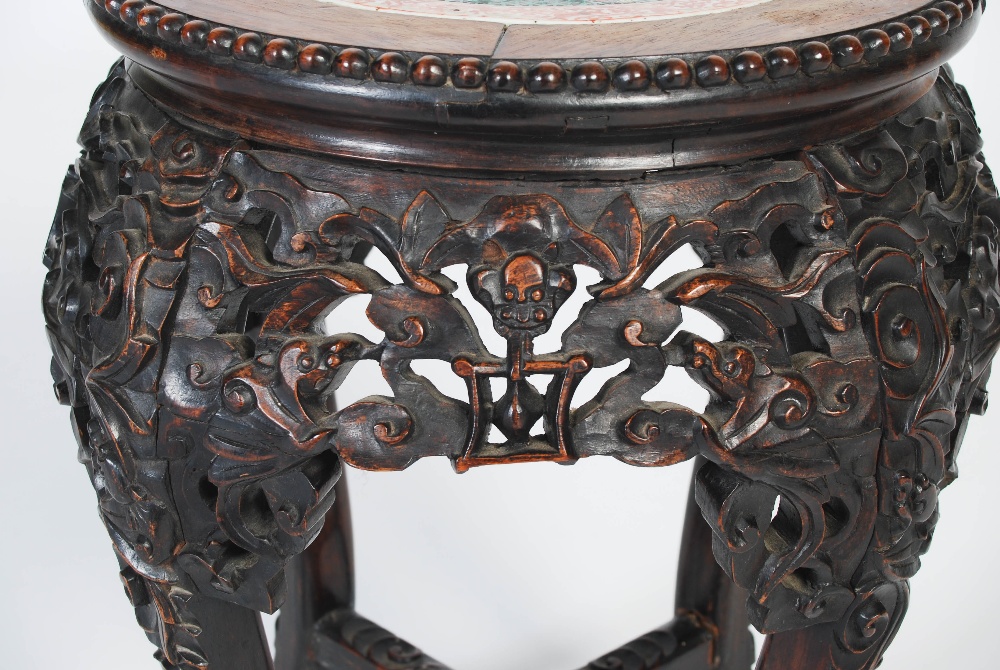 A Chinese dark wood jardiniere stand, Qing Dynasty, the circular top with a round porcelain panel - Image 2 of 7