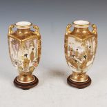 A pair of Japanese Satsuma pottery twin handled vases, Meiji Period, decorated with panels of bijin,