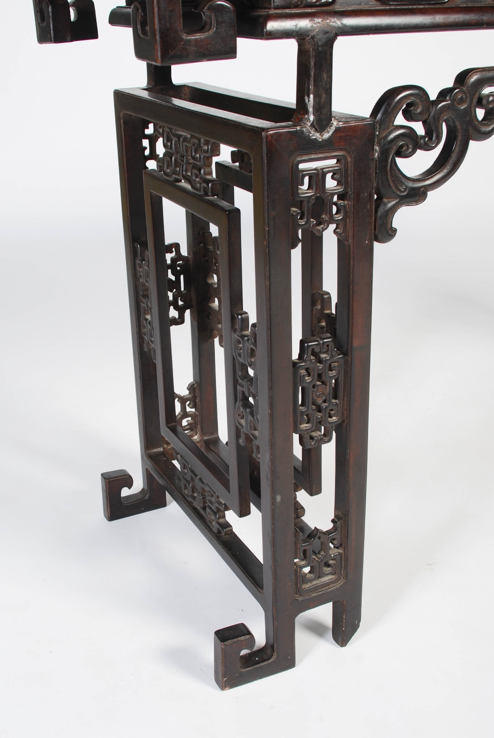 A Chinese dark wood table, late 19th/early 20th century, the rectangular panelled top above a - Image 3 of 10