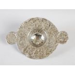 A Continental silver tea strainer, import marks, Chester 1901, the rim chased with putti, urns and