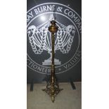 A 19th century gilt metal rise and fall paraffin burning standard lamp, EVERED'S PATENT NO.2, cast
