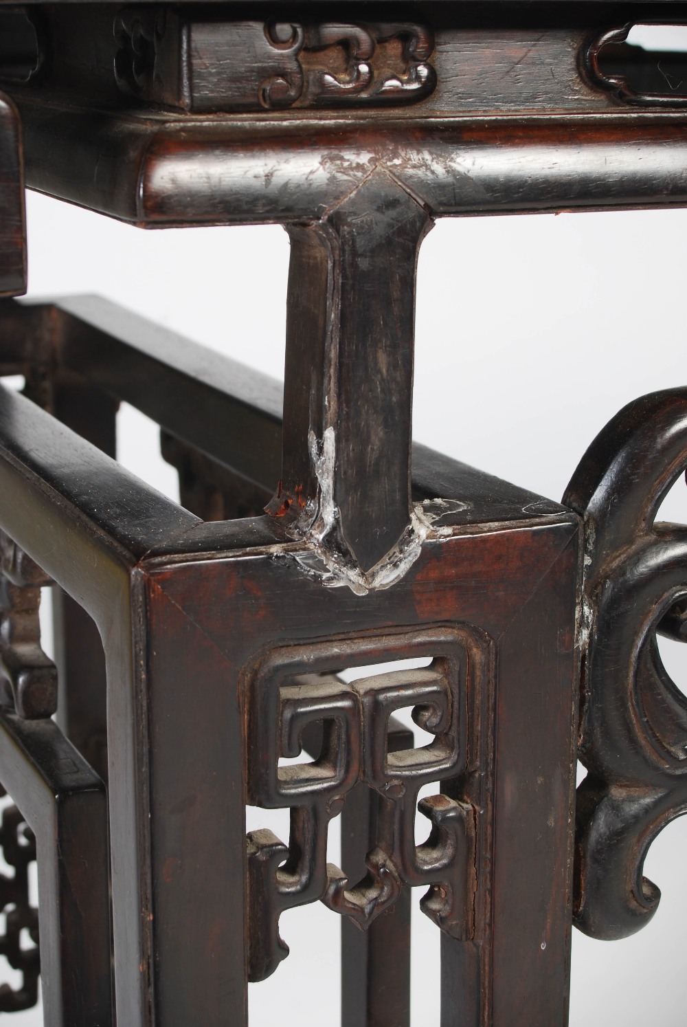 A Chinese dark wood table, late 19th/early 20th century, the rectangular panelled top above a - Image 6 of 10