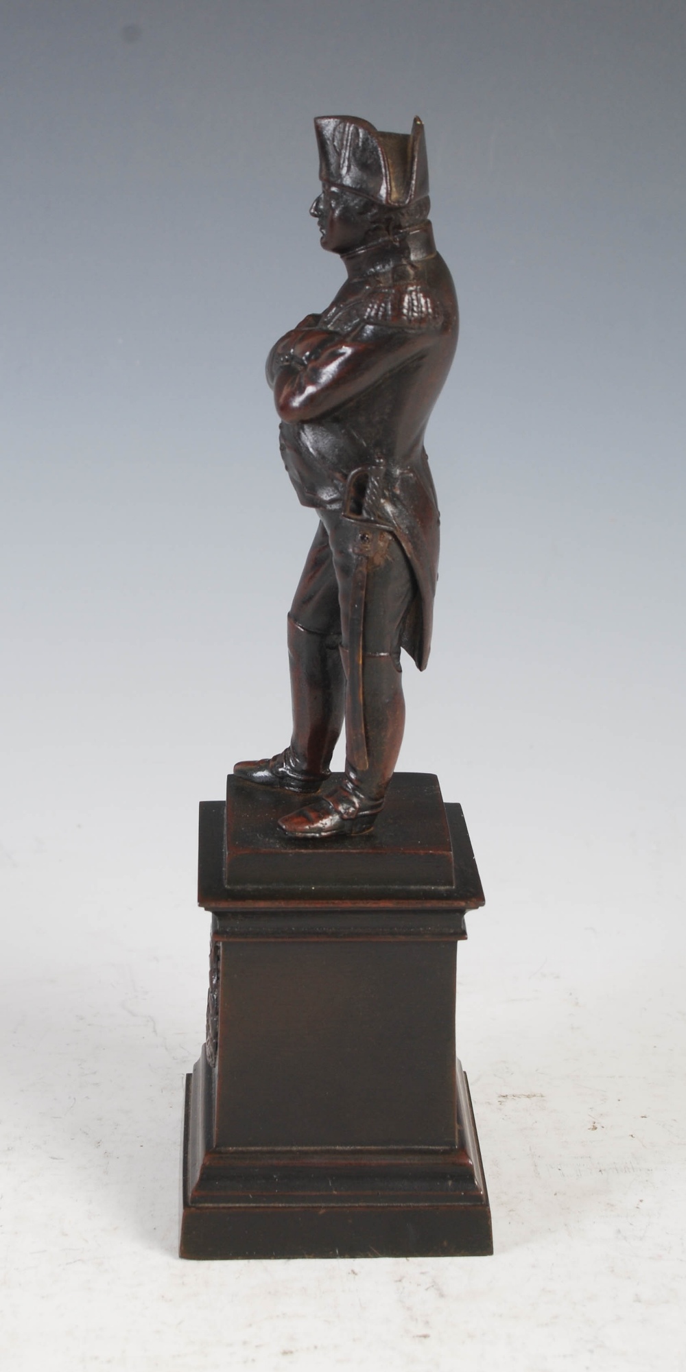 A bronzed spelter figure of Napoleon Bonaparte, modelled standing on square plinth base with oval - Image 2 of 7