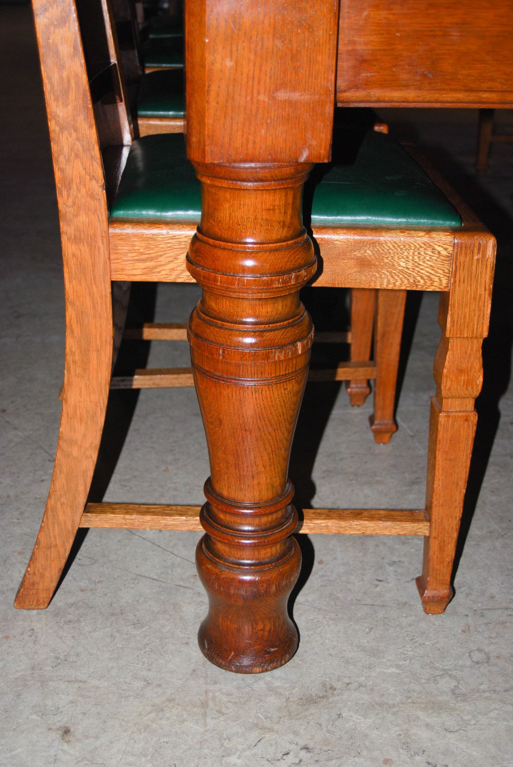 A late 19th century oak dining room room suite, comprising; an extending dining table enclosing four - Image 7 of 9