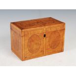 An early 19th century satinwood and burr walnut tea caddy converted to a stationery box, the