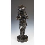 T. Thalenea, a late 19th/early 20th century bronze figure group of putto holding dragonflies, on